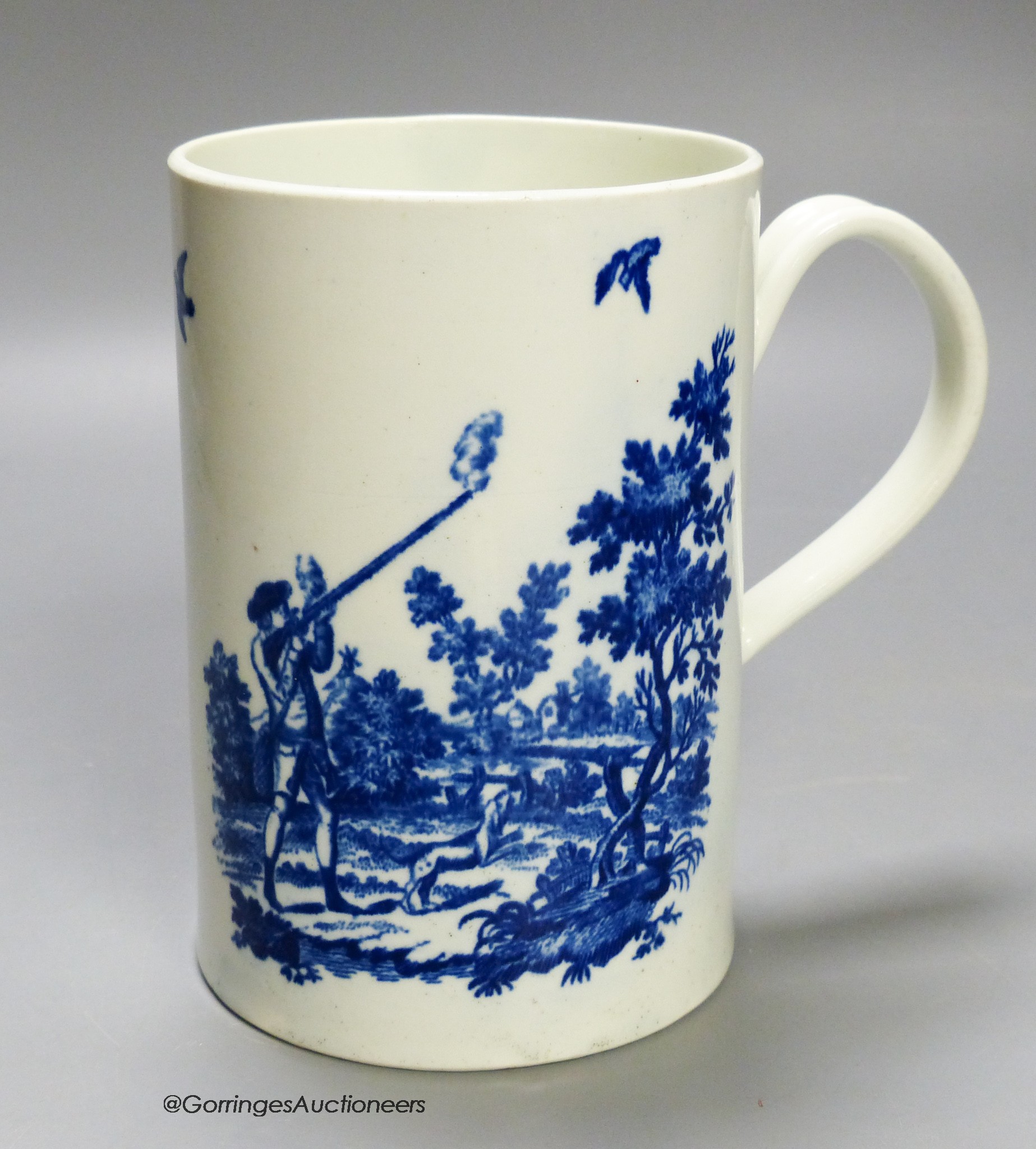 A Worcester 'Man holding gun' and 'Man shooting gun' patterns cylinder mug. Printed, shaded crescent mark, height 14cm